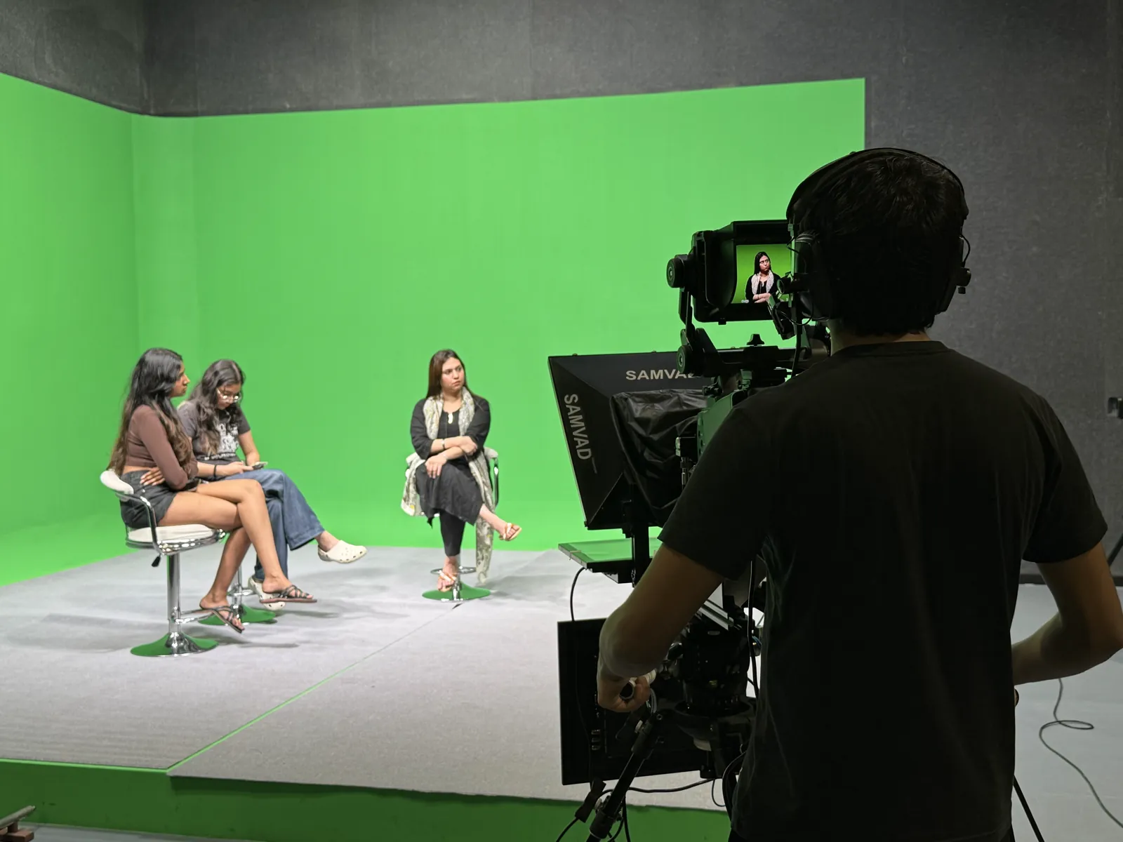 Arjun Agarwal filming a media session with a camera